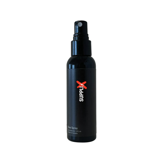 Clear bottle of SUPPLI-X Sea Spray texturizing hair mist infused with Himalayan pink salt and sea salt, delivering effortless