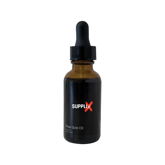 Elegant bottle of SUPPLI-X Anti-Aging Rose Gold Oil featuring rosehip and hemp seed oils, delivering antioxidants for brighte