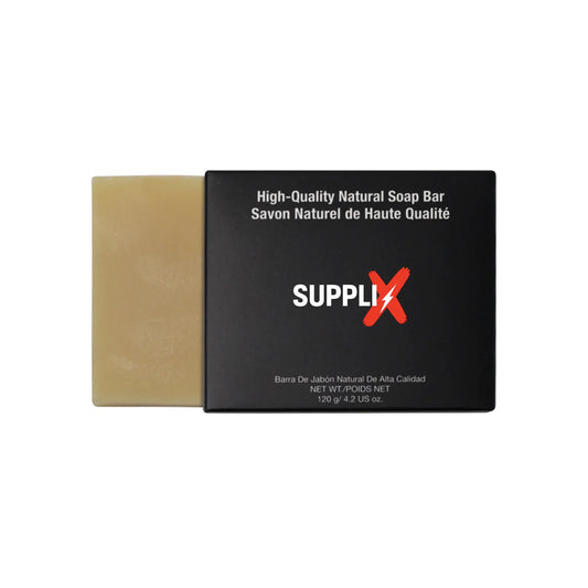 Close-up of SUPPLI-X Natural Tea Tree Soap bar, infused with eucalyptus, lavender oils and goat milk, showcasing bubbly lathe