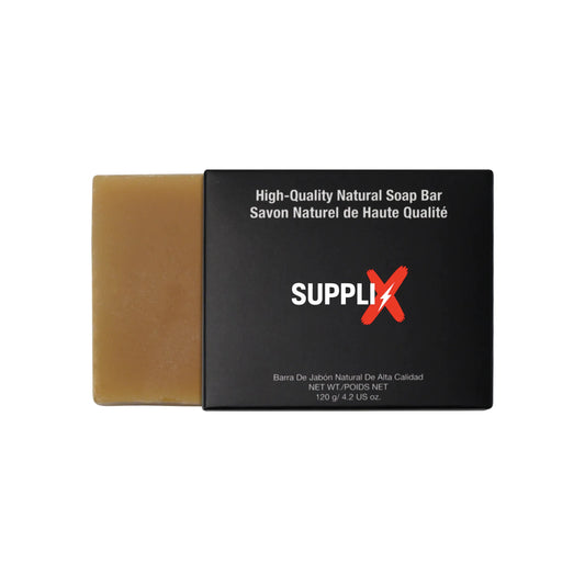 Vibrant yellow SUPPLI-X Natural Turmeric Soap bar infused with curcumin and goat milk, lathering on skin to reveal glowing, r