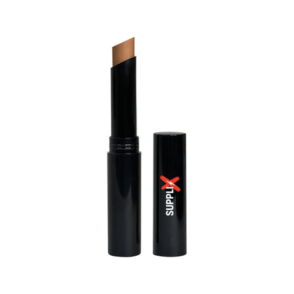 Pecan shade creme concealer stick gliding smoothly on skin, providing matte finish coverage for blemishes and dark spots, wit