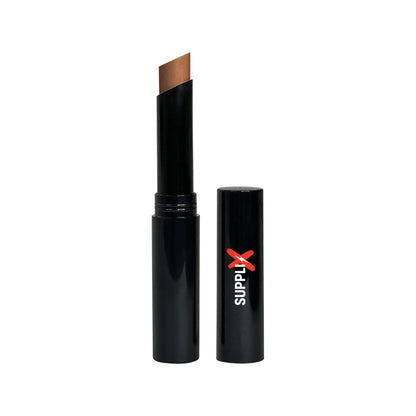 Compact oak shade creme concealer stick gliding on skin for seamless medium-to-full matte coverage, crease-proof formula with