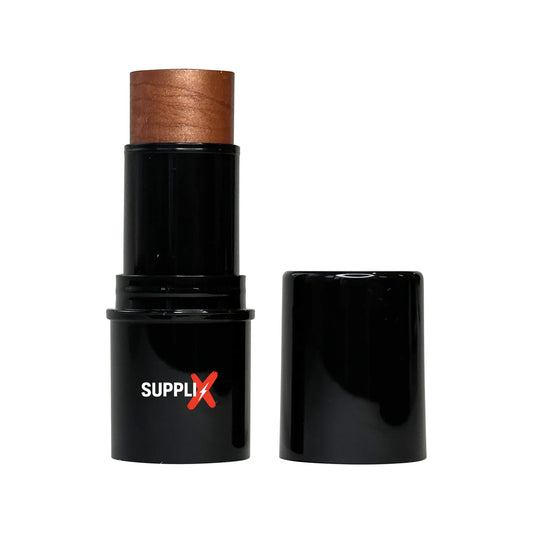 Shimmering bronze highlighter stick in sleek packaging, infused with vitamin C for radiant, nourished skin glow—perfect for c