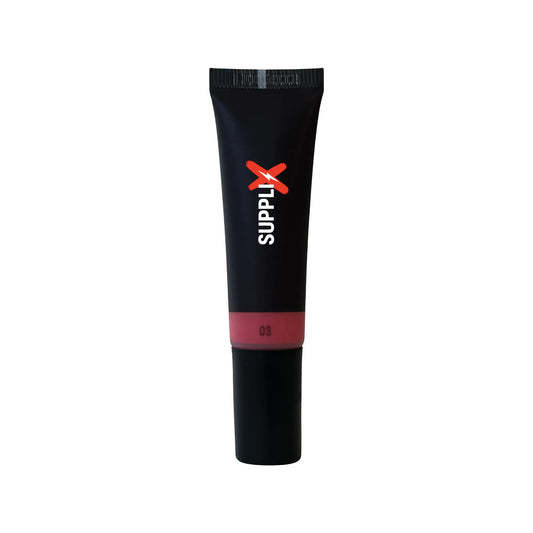 Sleek bottle of SUPPLI-X Liquid Blush in Pinch shade, showing blendable pink tint on dewy cheeks, vegan cruelty-free formula 