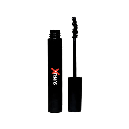 Close-up of SUPPLI-X Luxury Mascara in black tube with curved brush applying to voluminous, lengthened lashes, highlighting h