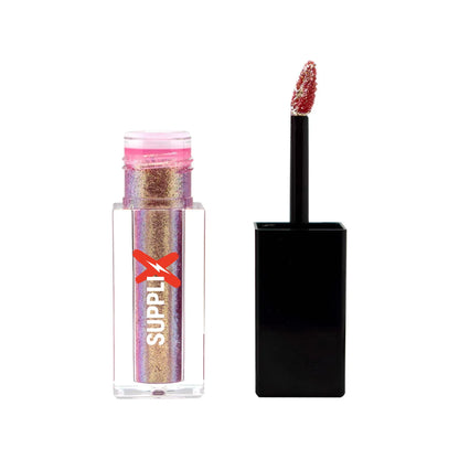 Vibrant hottie shade liquid shimmer applied on cheekbones delivering high-impact, smudge-proof shine with vegan, cruelty-free