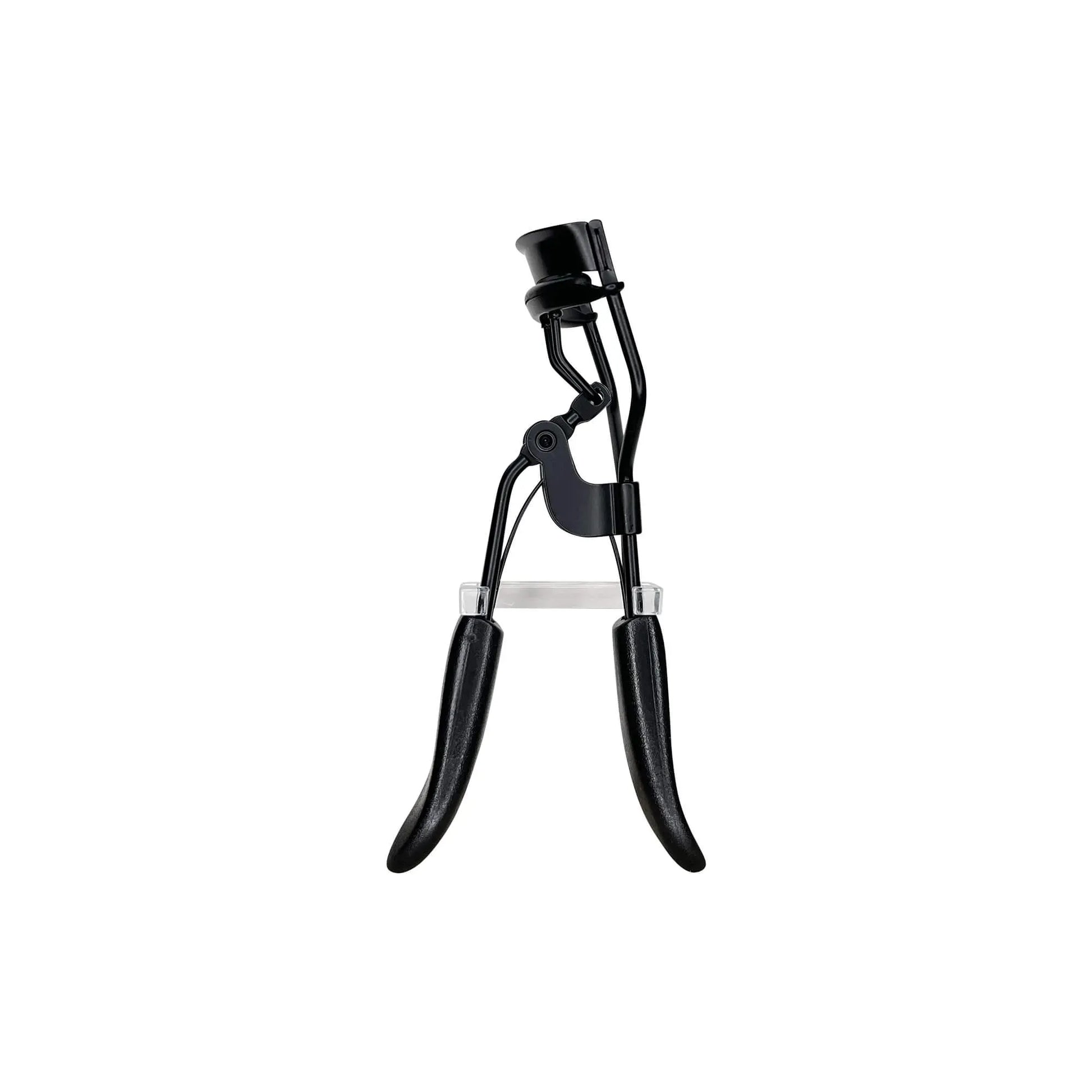 Close-up of SUPPLI-X padded eyelash curler with silicone padding and contoured clamp, curling natural lashes to dramatic flai