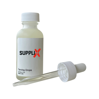 Clear glass dropper bottle of SUPPLI-X vegan tanning drops infused with grapefruit peel oil and coconut oil for intense hydra